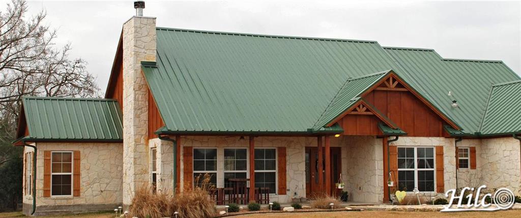 Green Steel Roofing with Cedar Trim